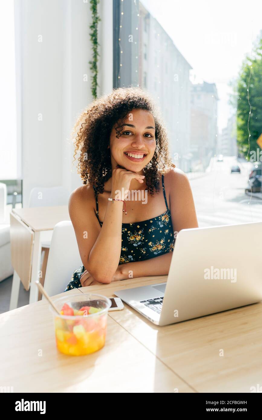 Woman using laptop in cafe Stock Photo