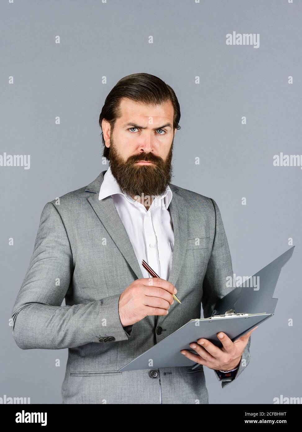 making notes. portrait of bearded man making notes. Confident ...