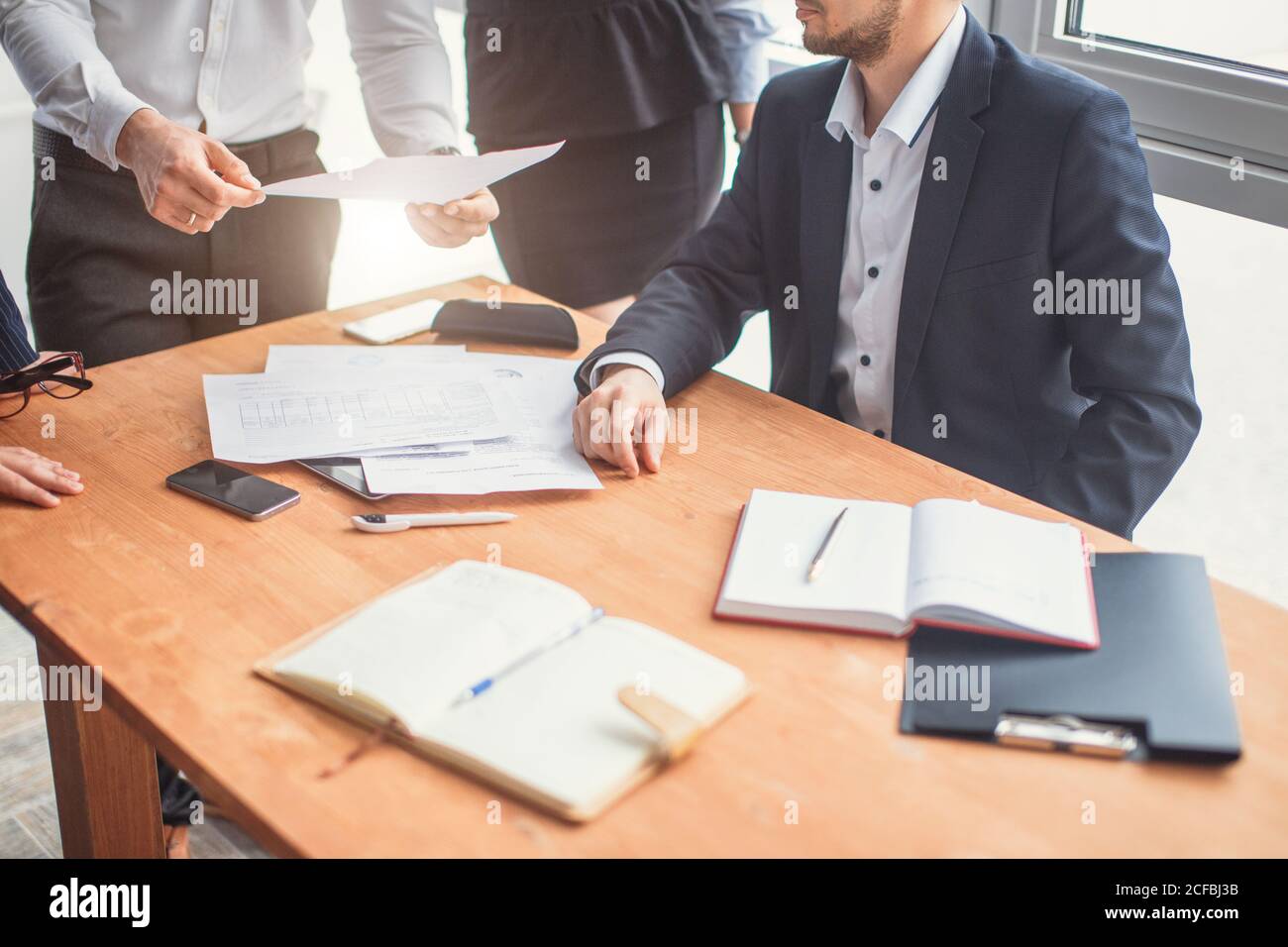 A group of successful businessmen. Discussion of the important contract ...