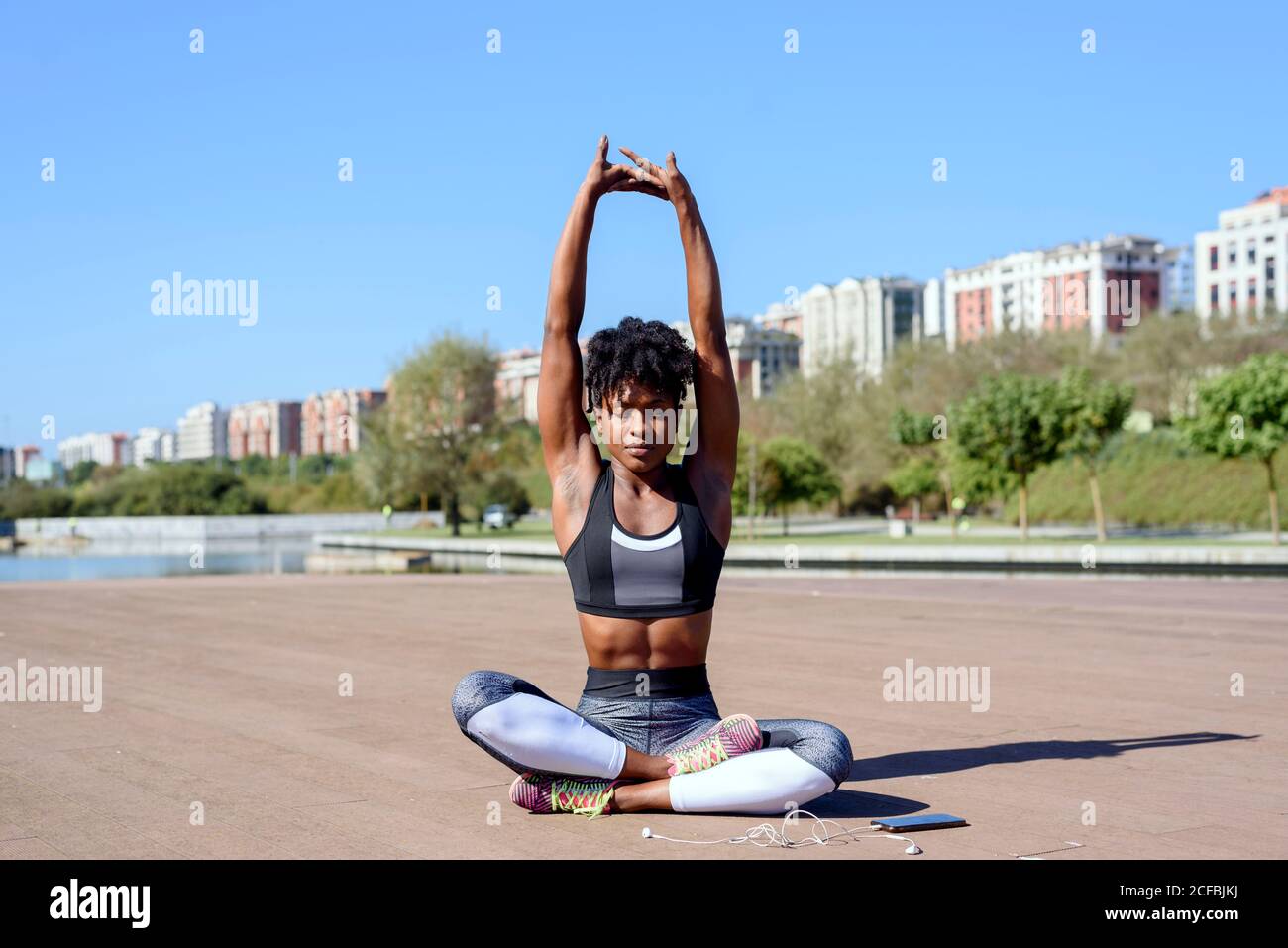 Boy exercising lotus pose during family yoga... - Stock Photo [96864019] -  PIXTA