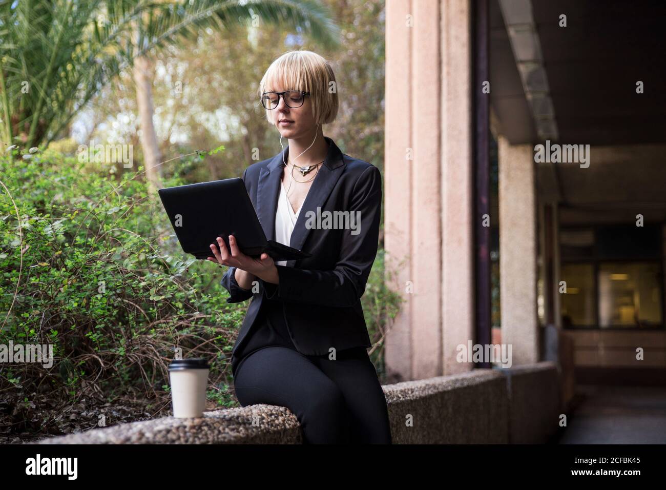 Young businessWoman sitting and using tablet Stock Photo