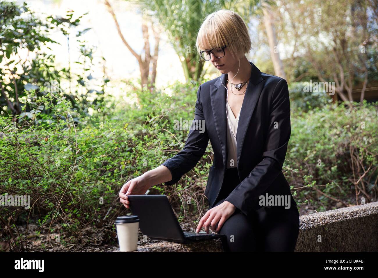 Young businessWoman sitting and using tablet Stock Photo