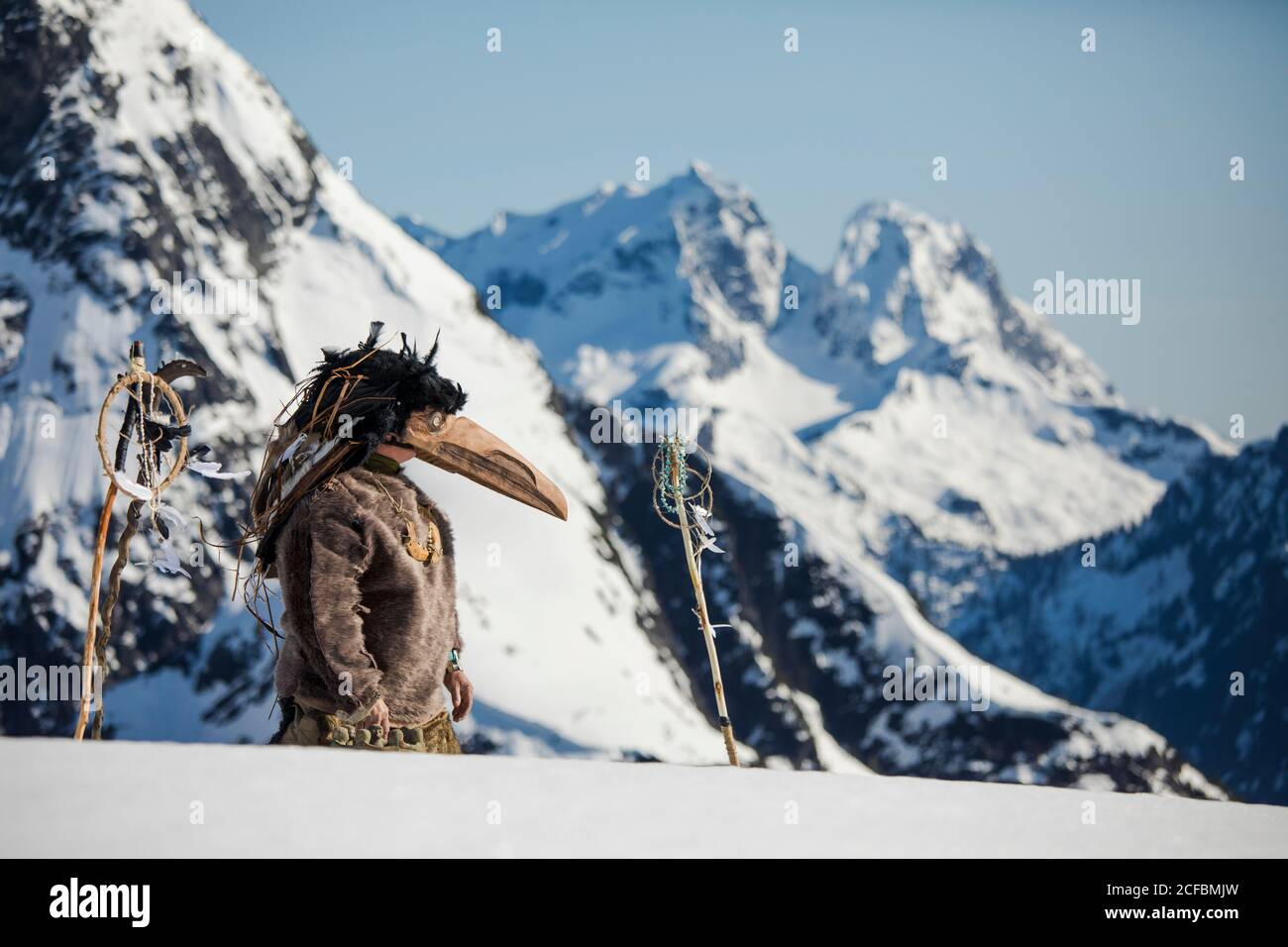 First Nations person dressed in Ravens mask preforms a ceremony Stock ...