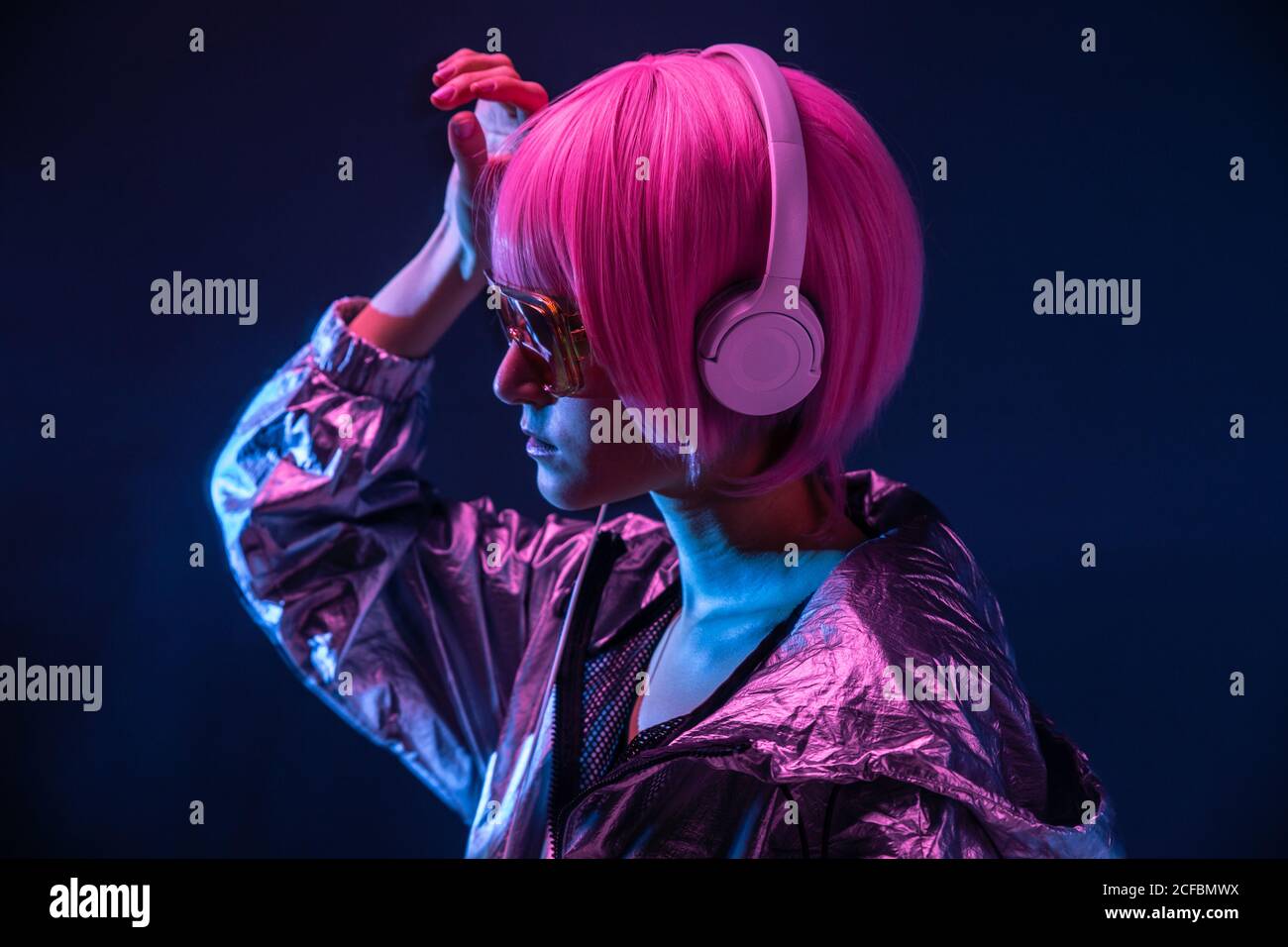Trendy Japanese young pretty Woman in red sunglasses and headphones