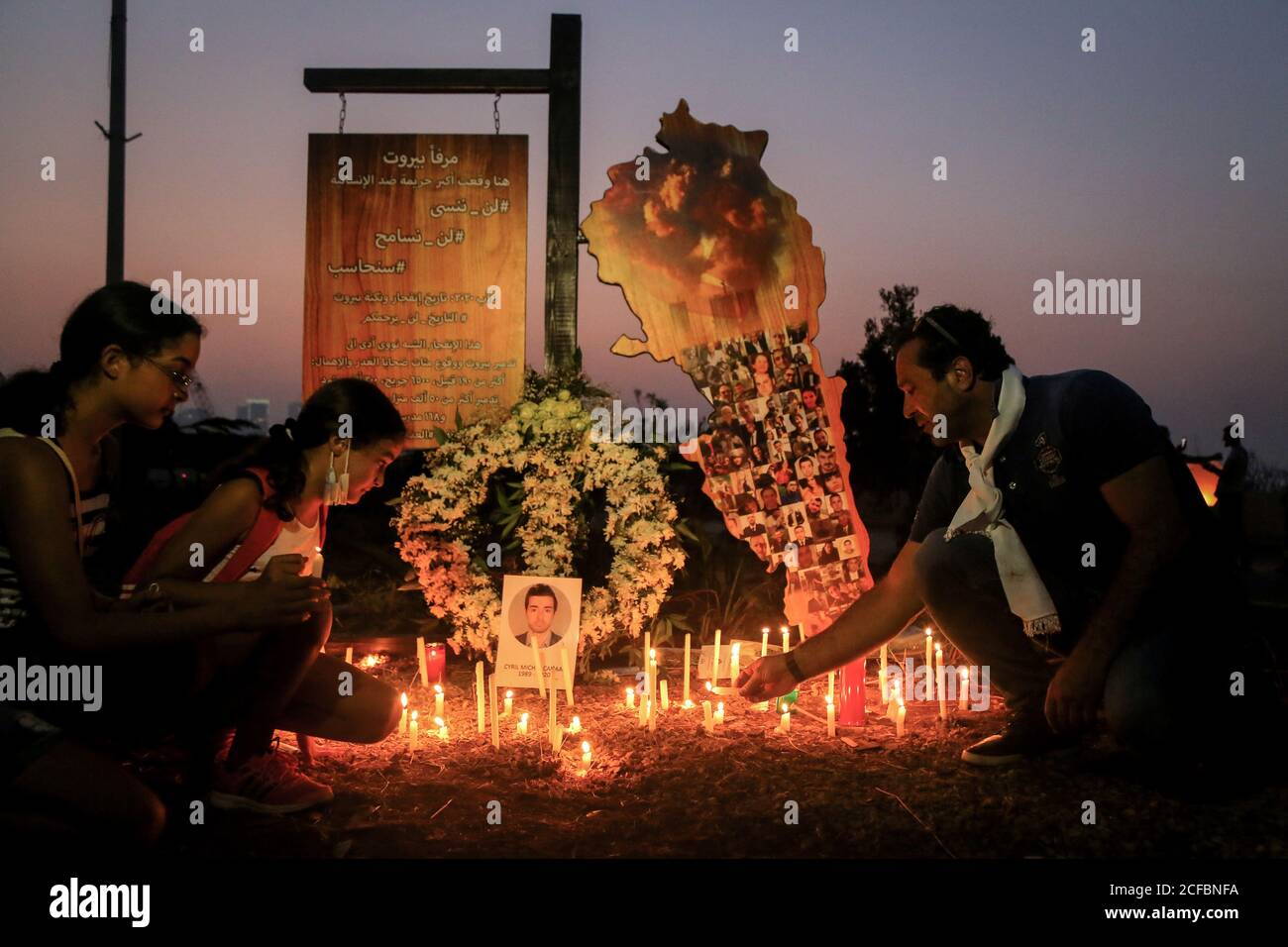 Beirut, Lebanon. 04th Sep, 2020. Relatives of victims of Beirut's massive explosion light candles during a memorial to mark one month since the explosion. Credit: Marwan Naamani/dpa/Alamy Live News Stock Photo