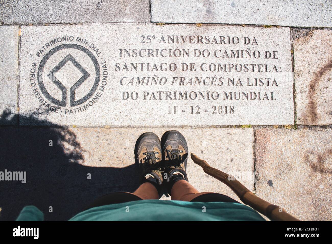 feet and cane with written on the ground in the Plaza de Santiago Stock Photo