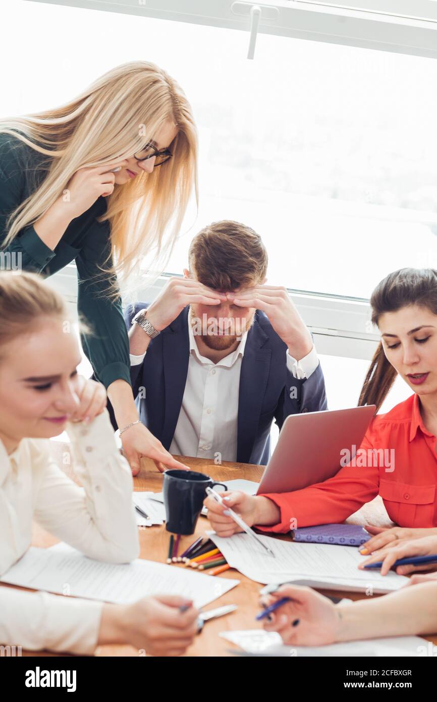 Smart businessman thinking about something in office Stock Photo