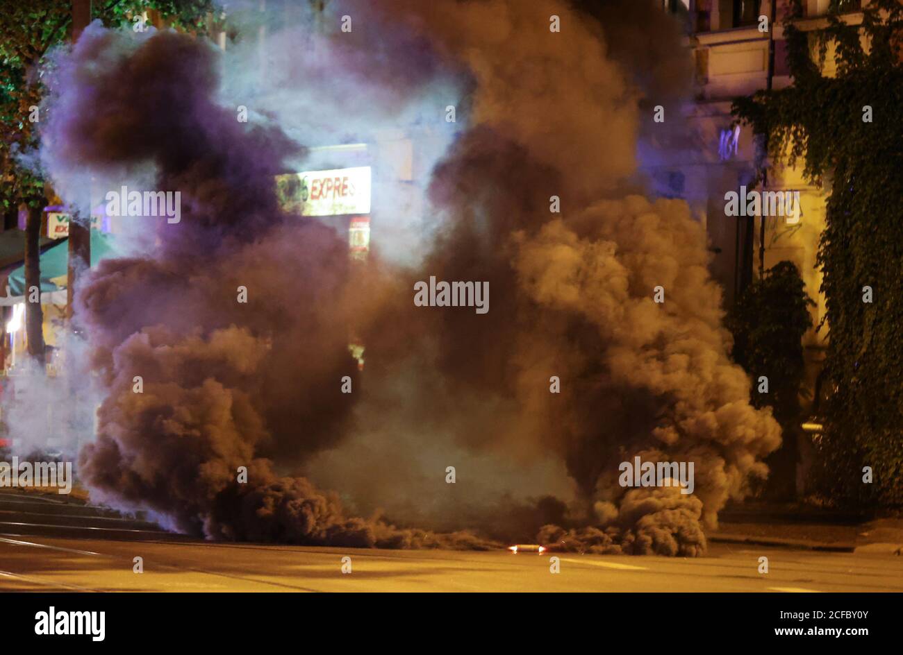 Leipzig, Germany. 04th Sep, 2020. A smoke grenade burns in the street as  protesters protest against the eviction of an occupied house. Activists of  the group "Occupy Leipzig" had occupied a vacant