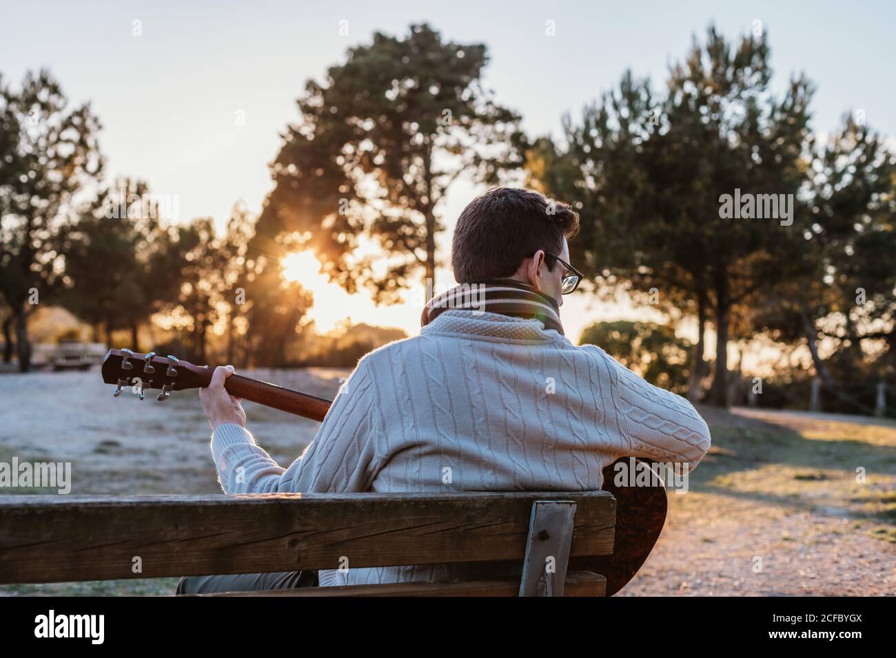 man playing the guitar on the outside Stock Photo