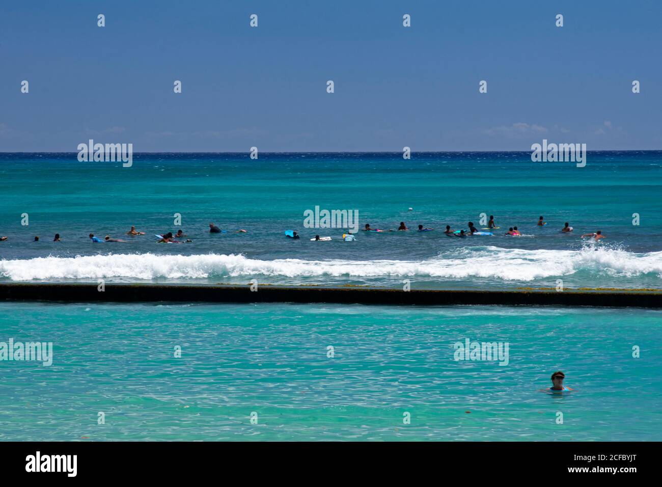 Surf line-up at Waikiki Beach, Honolulu, Oahu, Hawaii, USA Stock Photo