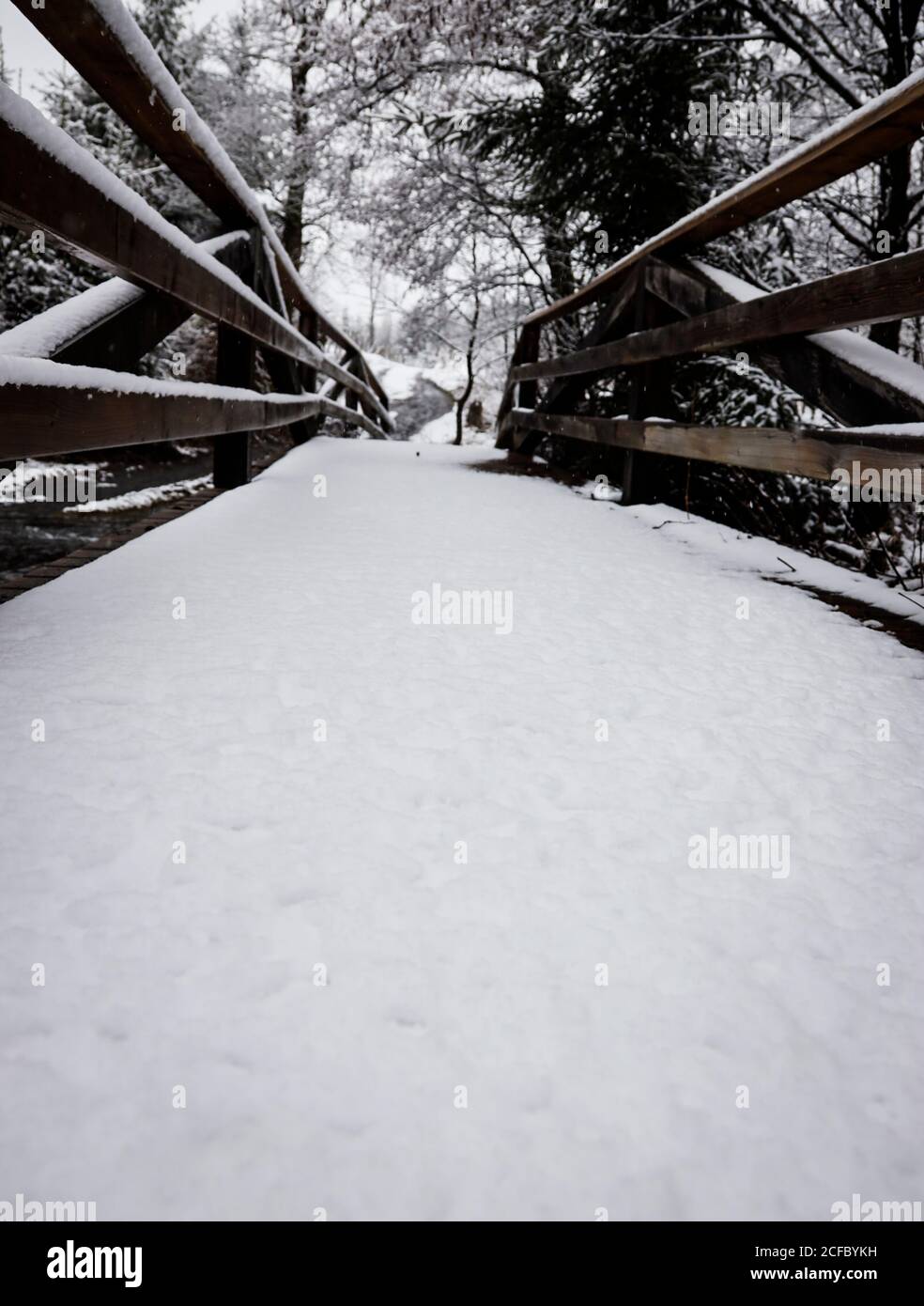 Bridge with snow and railings Stock Photo