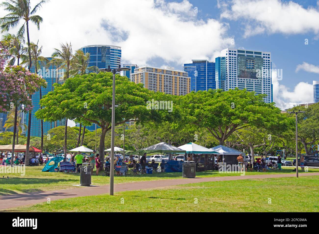Family gatherings enjoying the summer at Ala Moana Beach Park, Honolulu, Oahu, Hawaii, USA Stock Photo