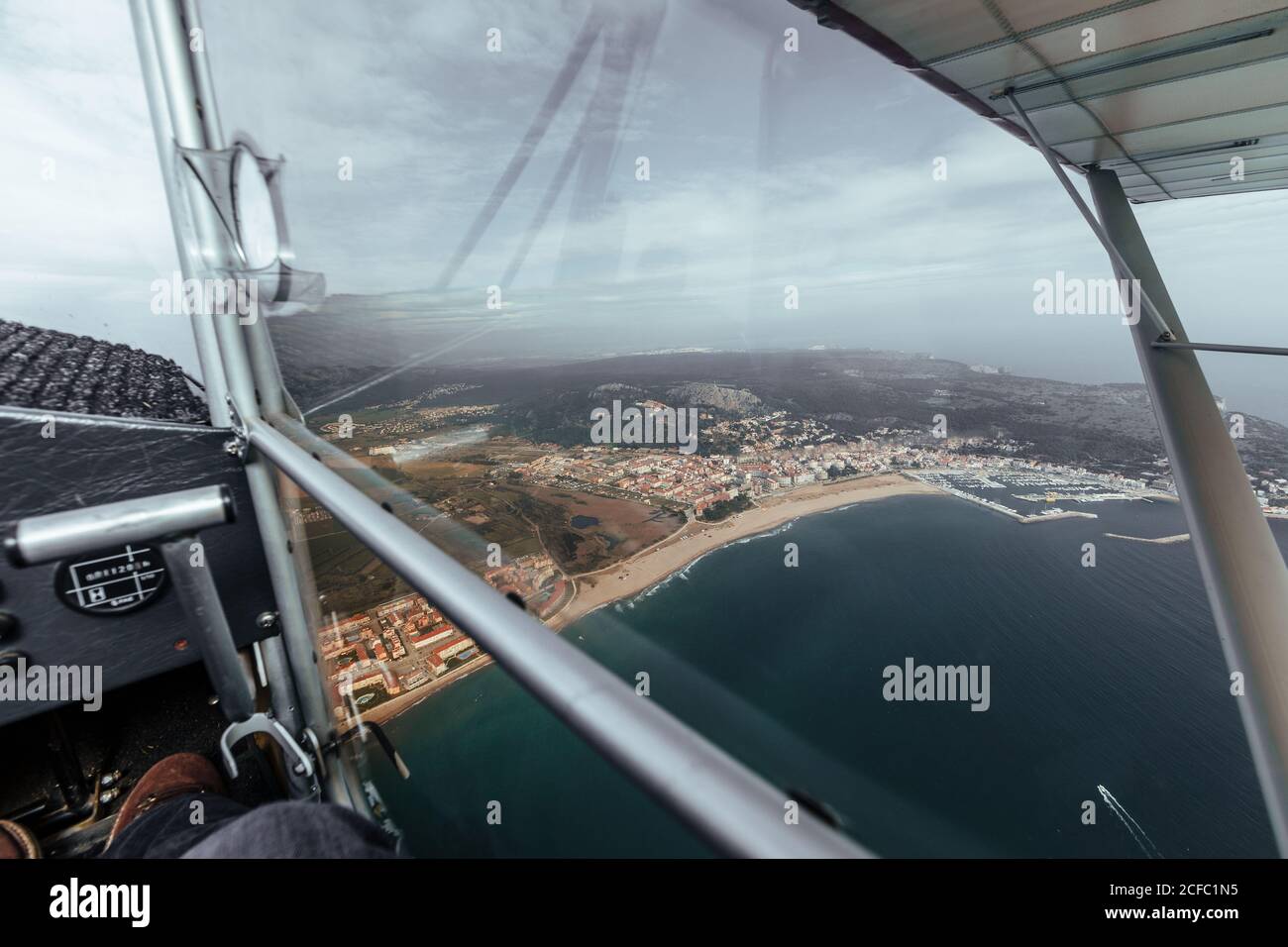 Aerial view on some islands from the inside of a small plane Stock Photo