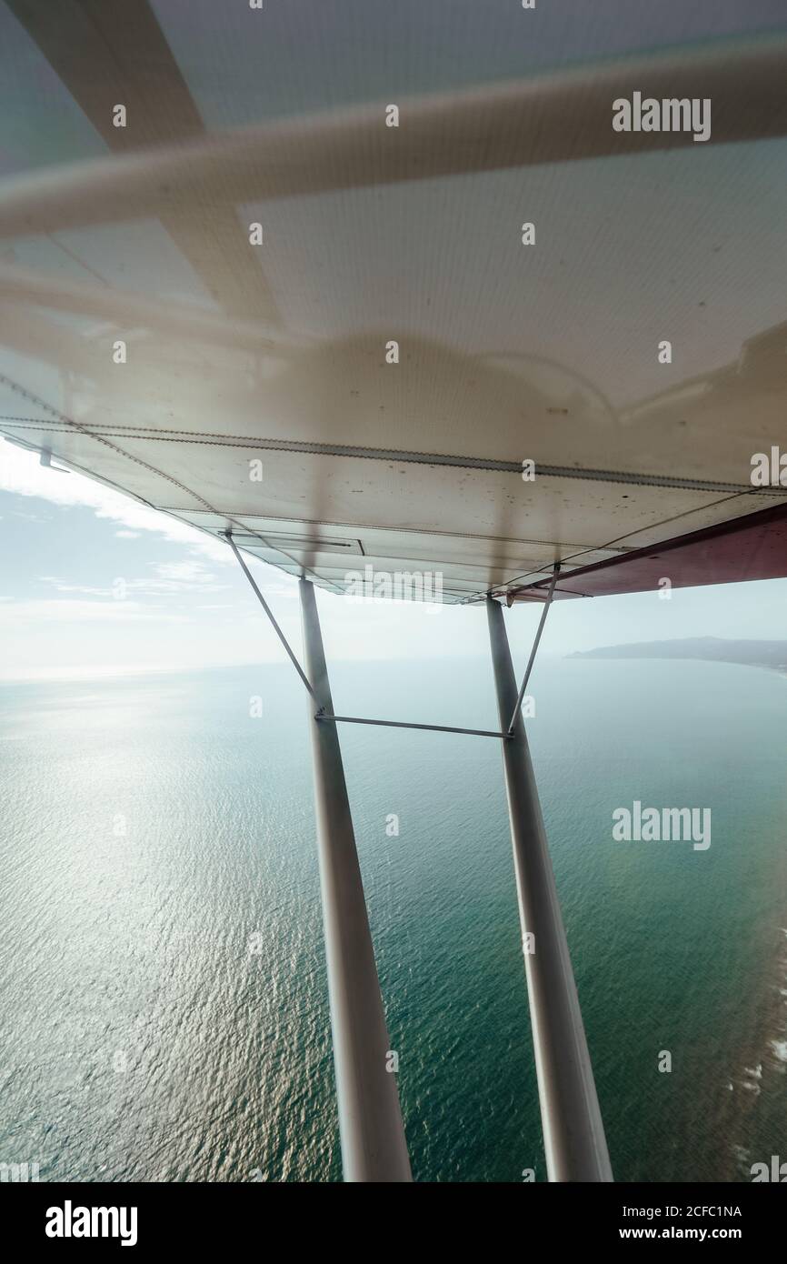Aerial view of the sea from the inside of a small plane Stock Photo