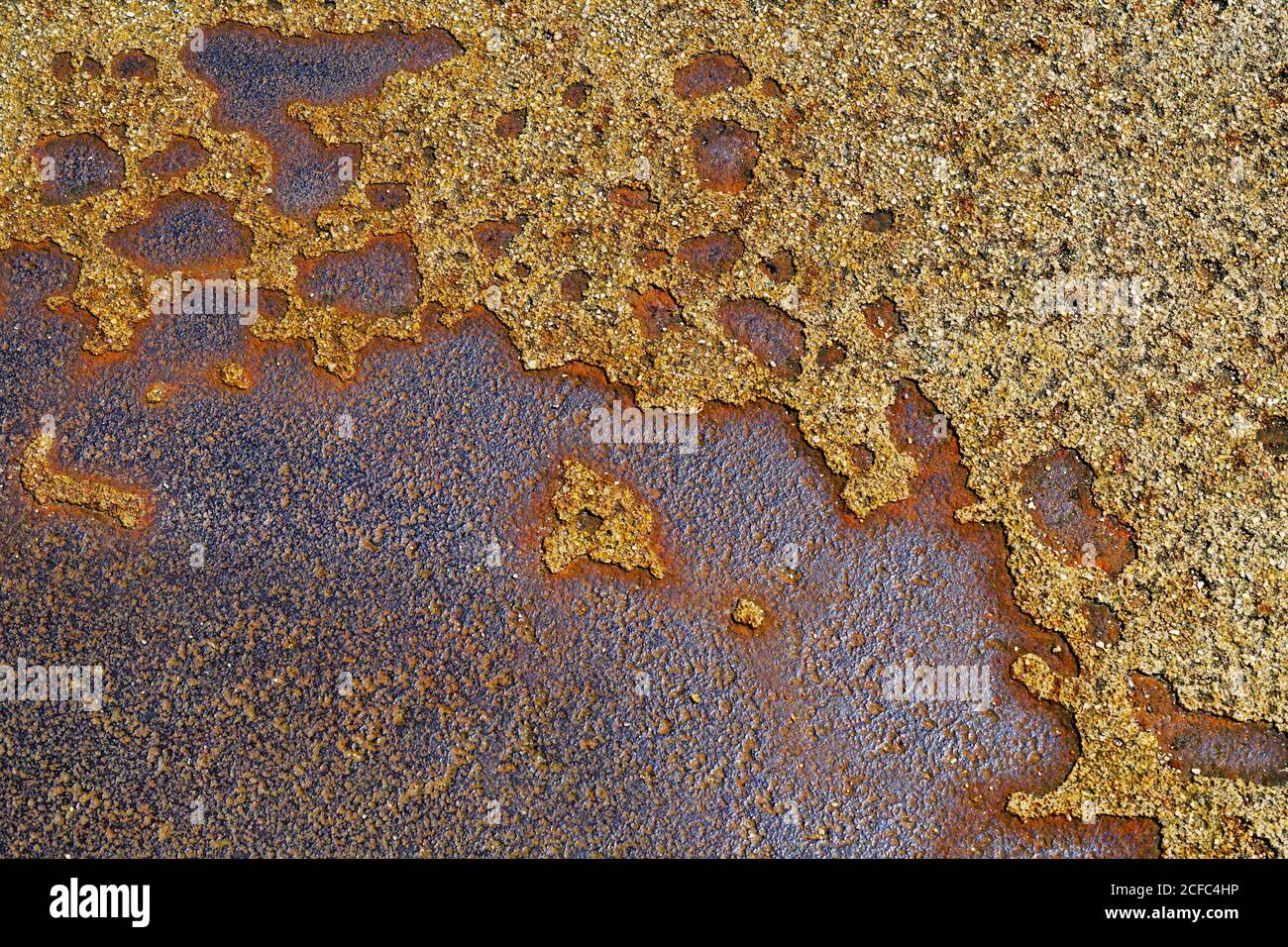 Closeup of painted rusty iron surface with corrosion spots and dirt Stock Photo