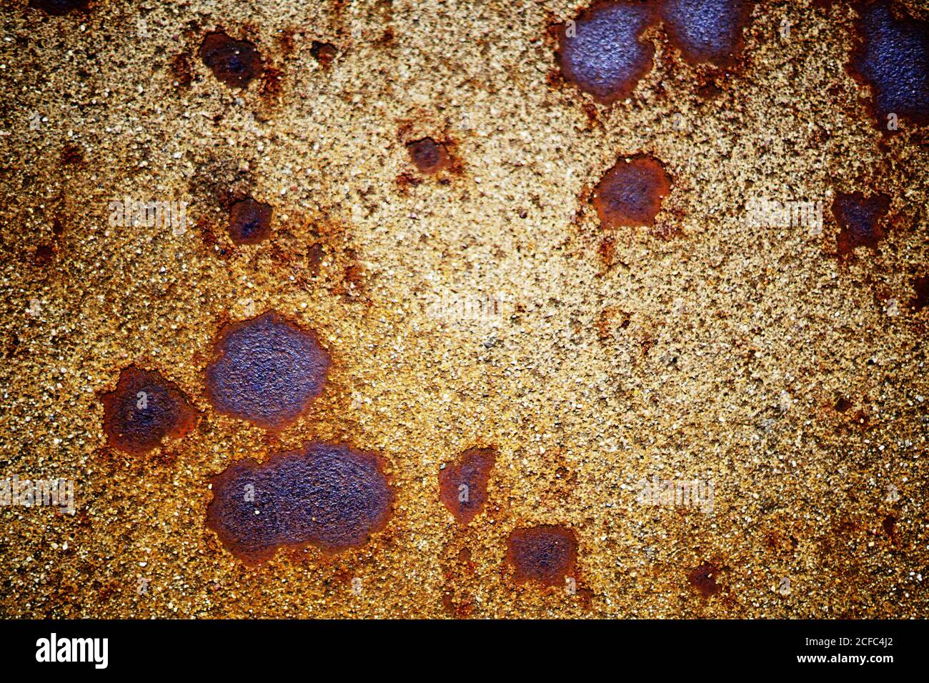 Closeup of painted rusty iron surface with corrosion spots and dirt Stock Photo