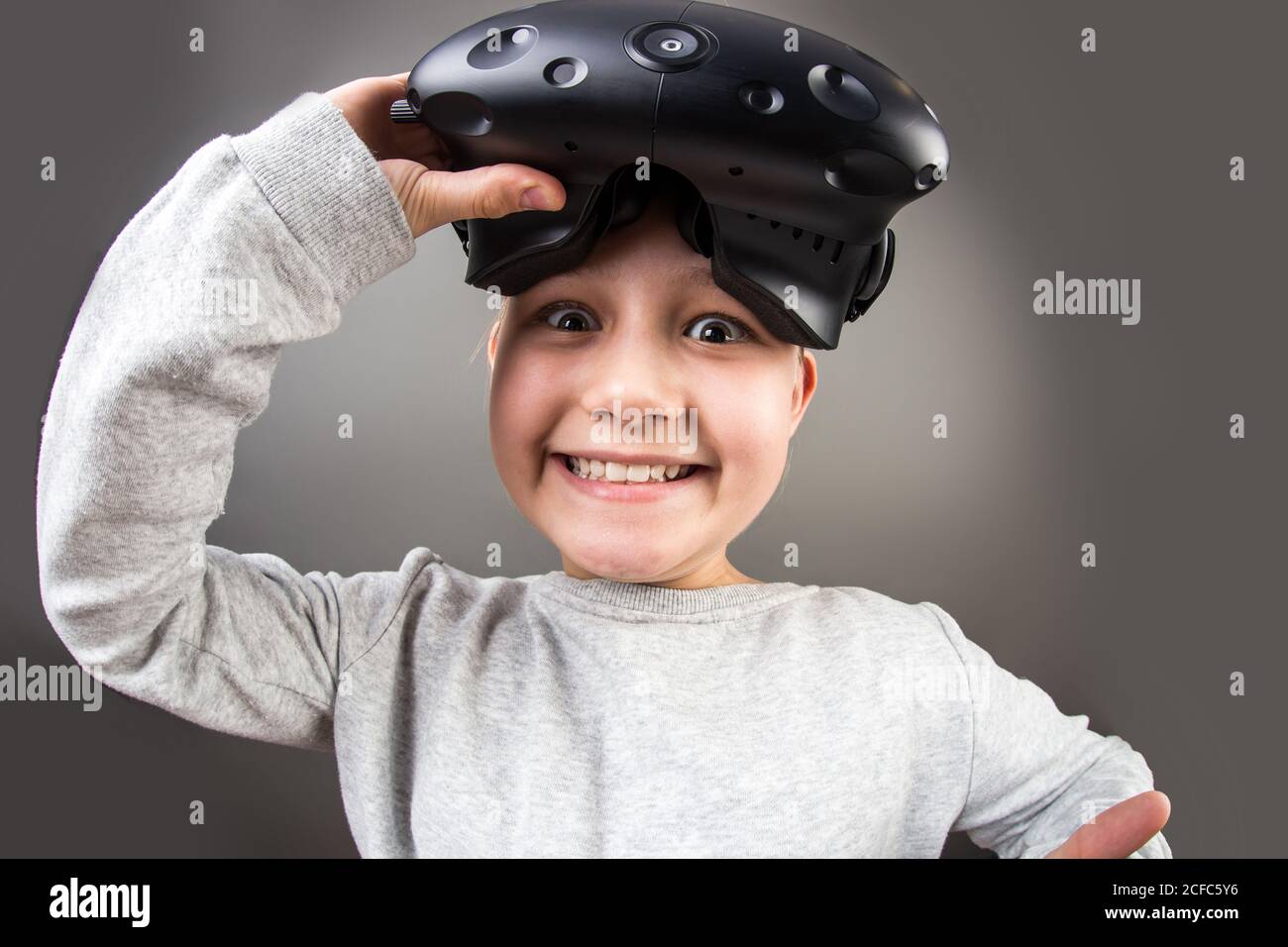 Child remove virtual reality headset Stock Photo Alamy