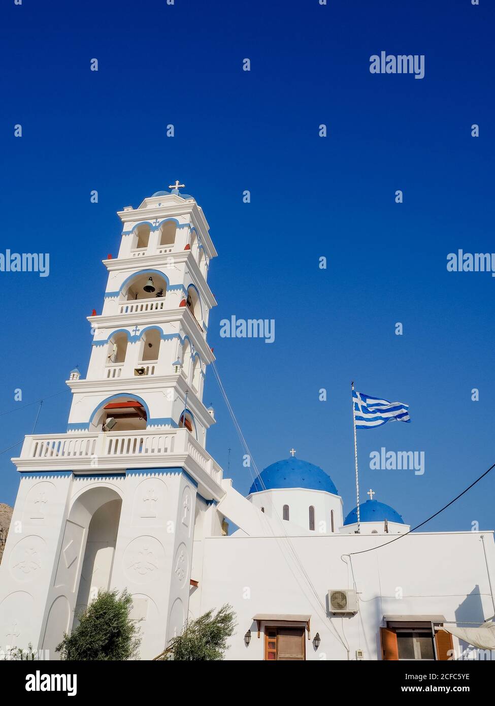 Church in Perissa on Santorini Greece with blue dome and white stone Stock Photo
