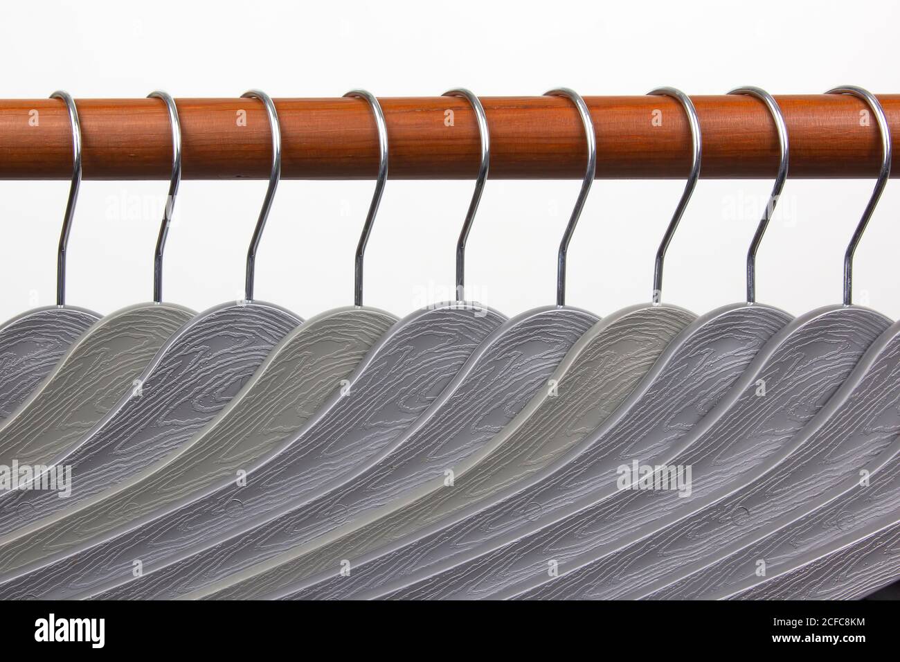 Set of gray clothes hangers on a white background Stock Photo Alamy