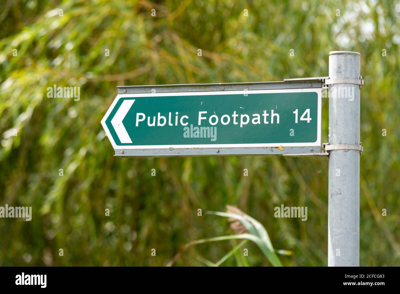 Public footpath 14 signpost in Great Wakering, Essex, UK. Public right of way route number 14 sign post in rural countryside area. Walking route Stock Photo