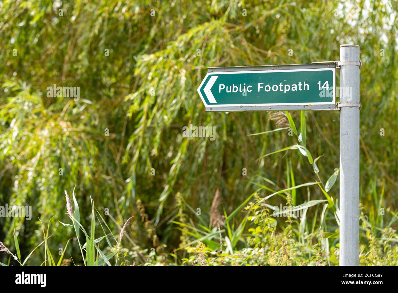 Public footpath 14 signpost in Great Wakering, Essex, UK. Public right of way route number 14 sign post in rural countryside area. Walking route Stock Photo