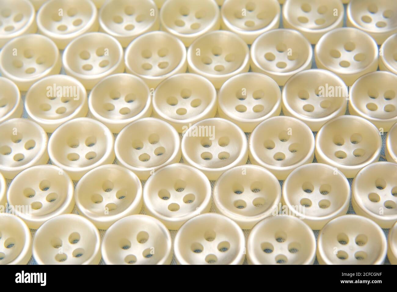 Plastic buttons for clothes. Background and texture. Fashion and