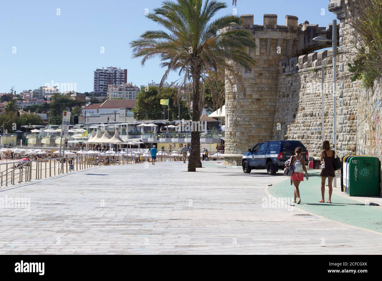 Estoril beach image featuring palm, castle and police patrol Stock Photo