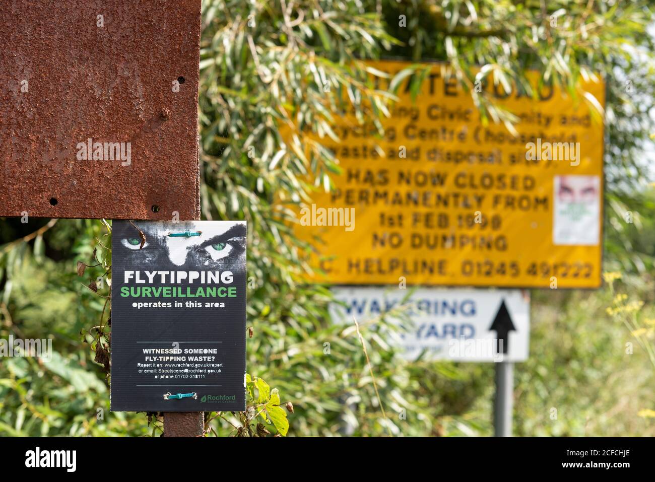Flytipping, fly tipping, surveillance warning sign in Great Wakering, Essex, UK. Rural country lane on route to closed waste disposal site Stock Photo