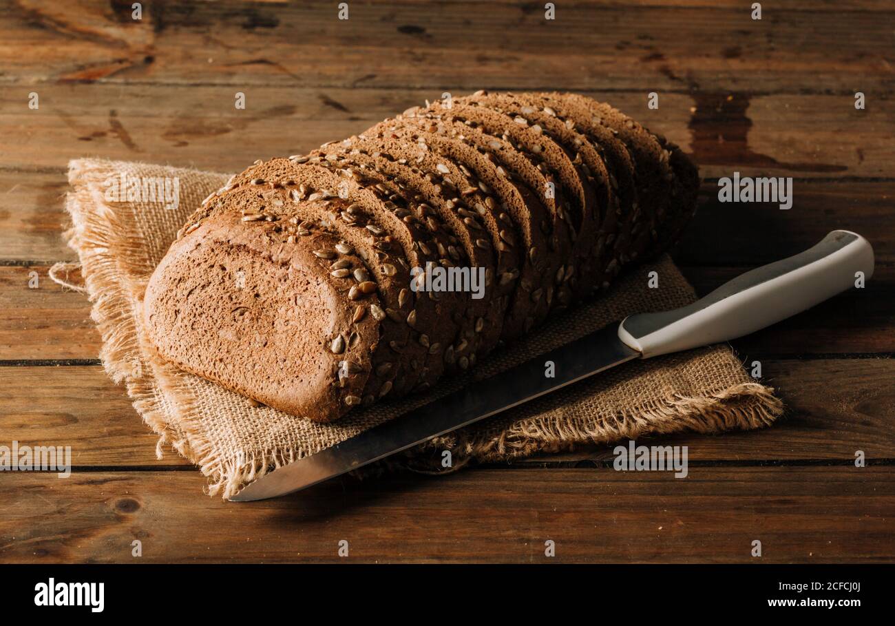 Freshly baked rye bread on napkin on table Stock Photo