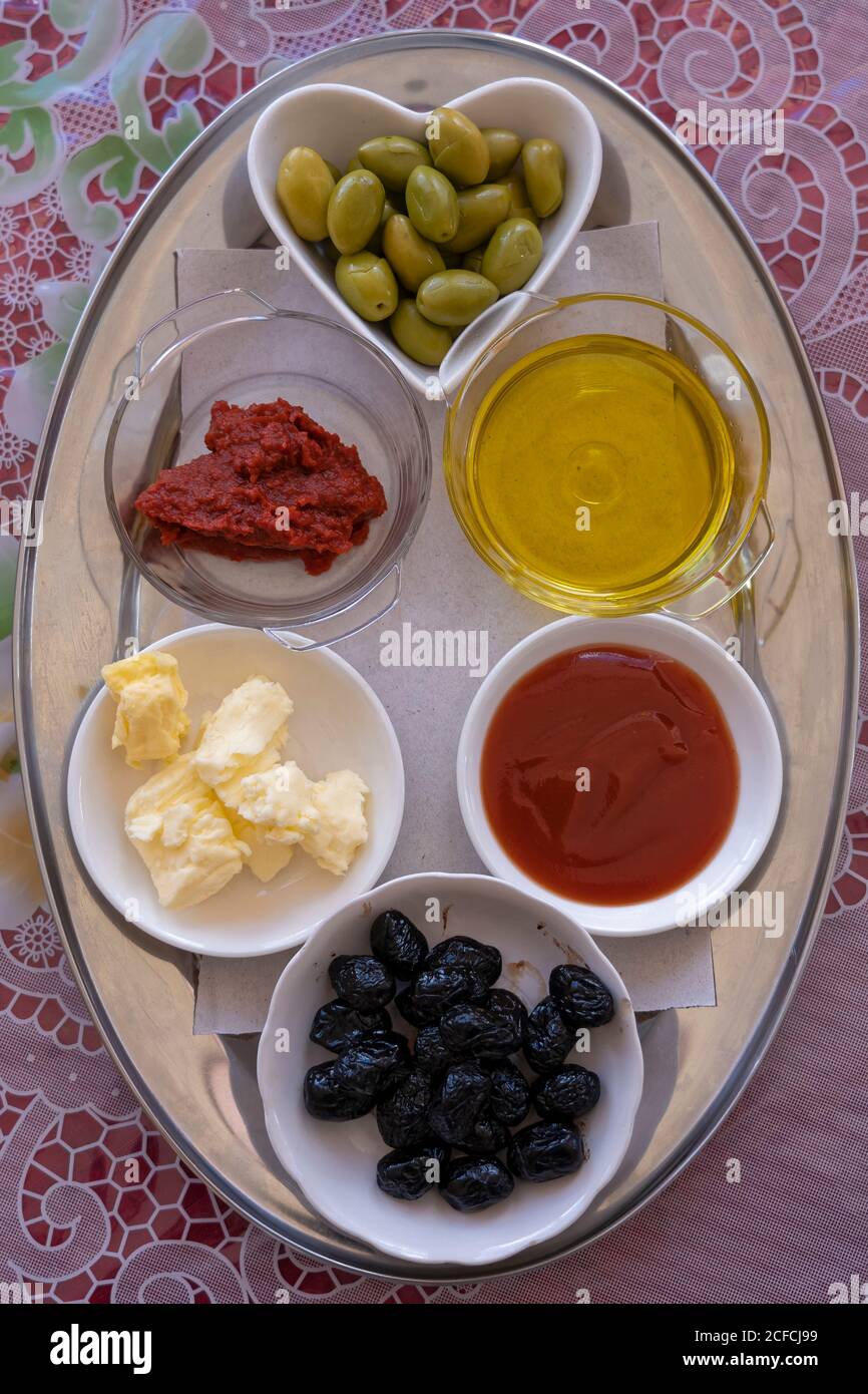 butter, Chez Rafiq Restaurant, condiments, food tray, High Atlas Mountains, Morocco, near Tizi n'Tichka mountain pass, olive oil, olives, condiments, Stock Photo