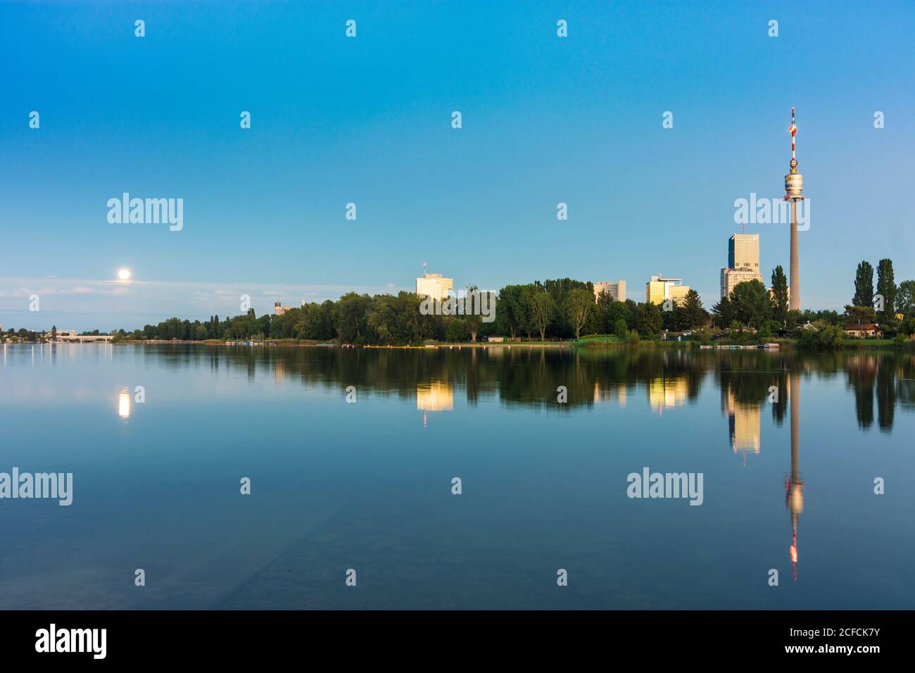 Wien / Vienna, oxbow lake Alte Donau (Old Danube),  tower Donauturm, DC Tower 1, full moon rising in 22. Donaustadt, Vienna, Austria Stock Photo