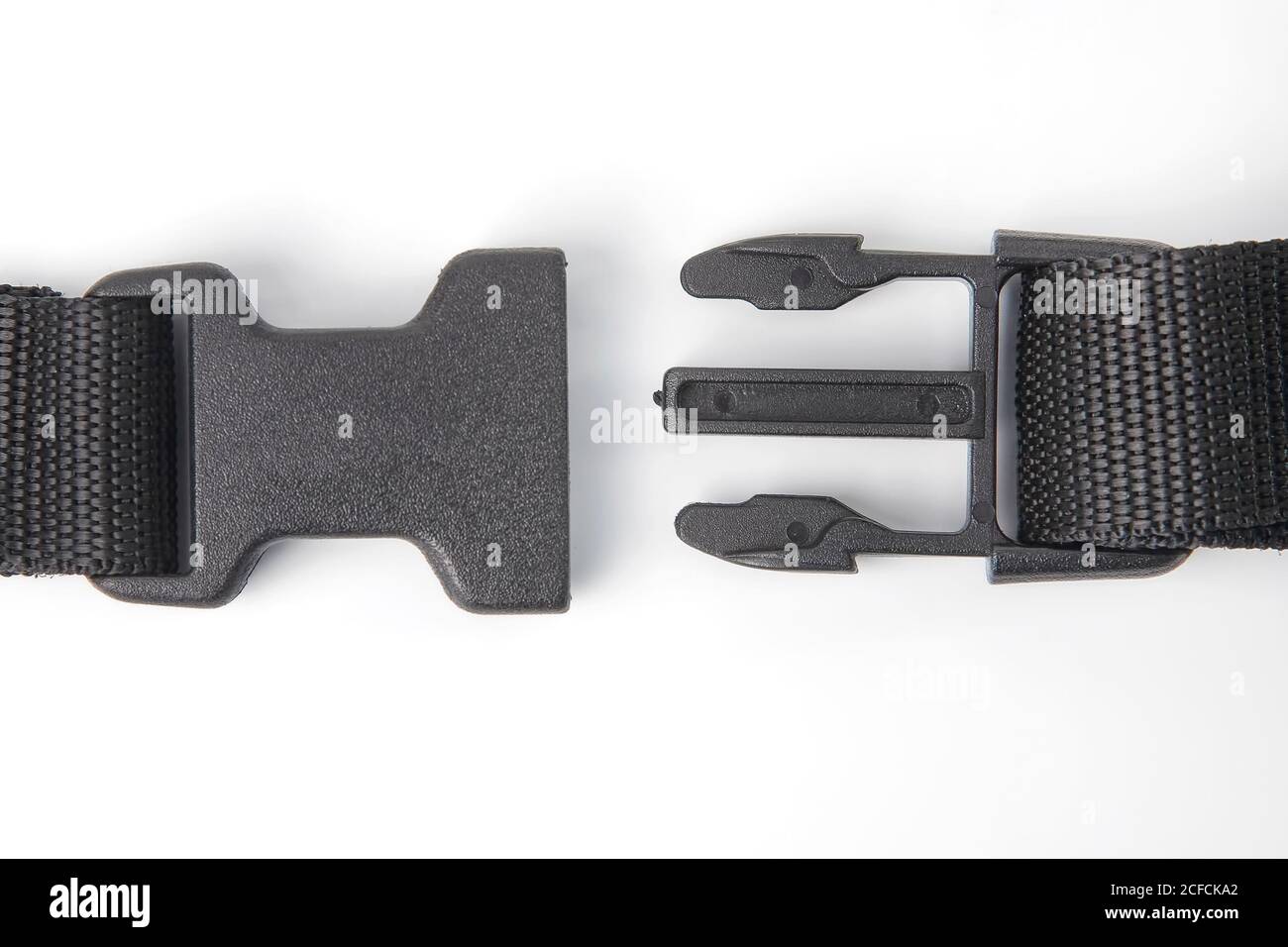 black plastic Fastex clip for backpacks on a white background. items of