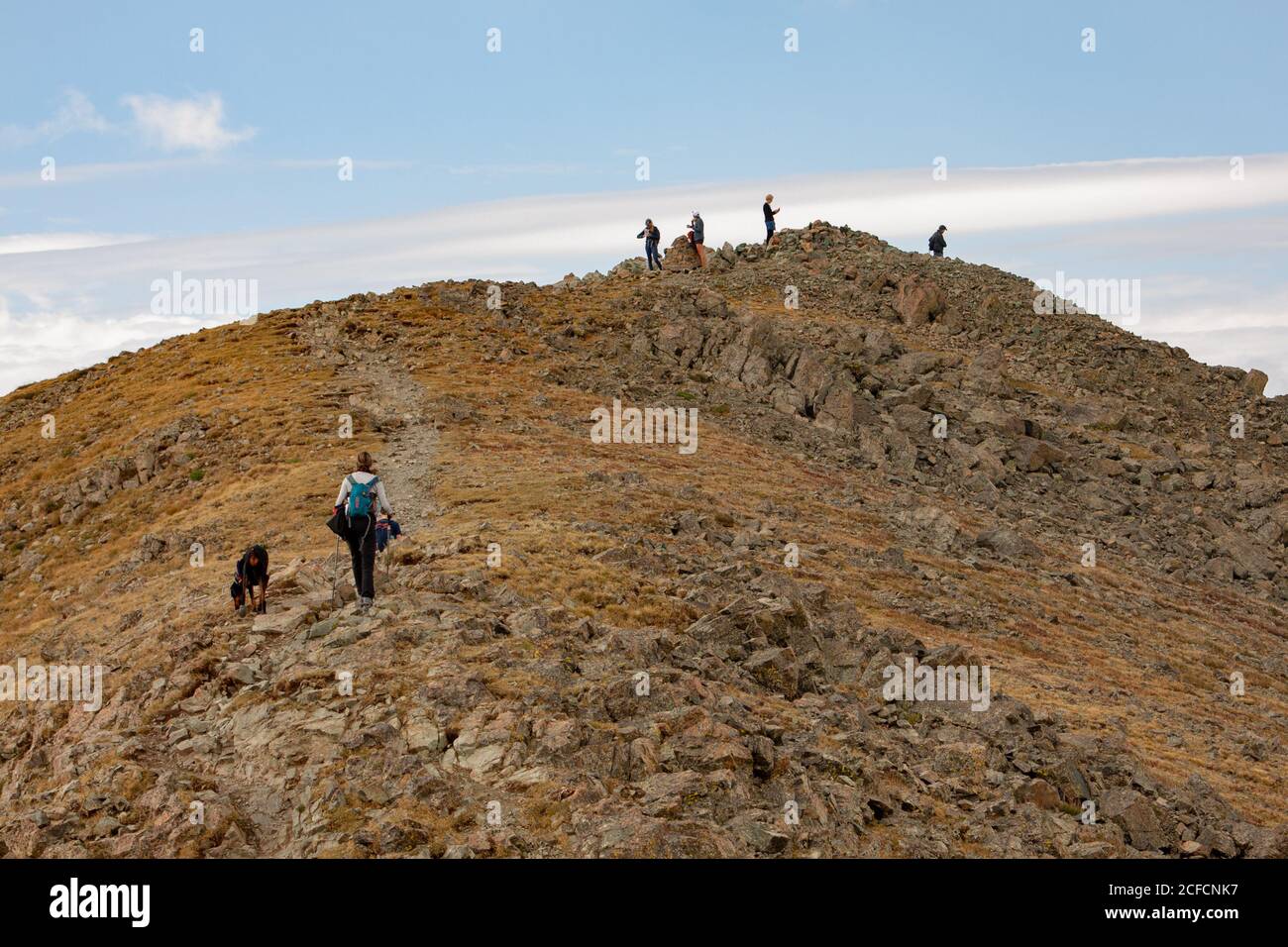 Hikers climb to the top of Wheeler Peak in the Sangre de Cristo mountain range in Taos, New Mexico, USA Stock Photo
