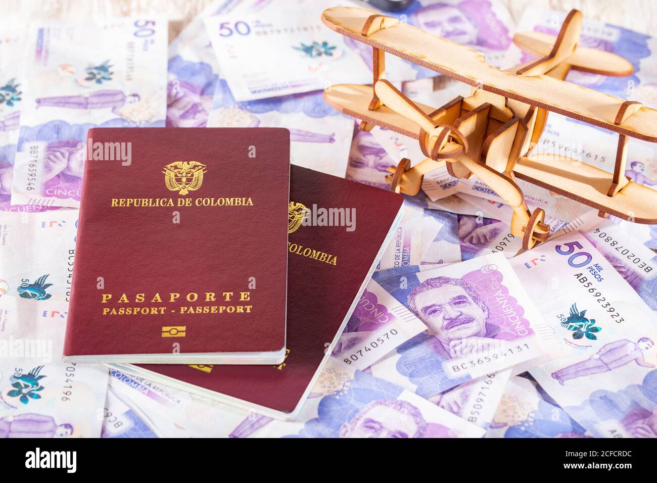 Colombian passport on Colombian money, close-up image Stock Photo