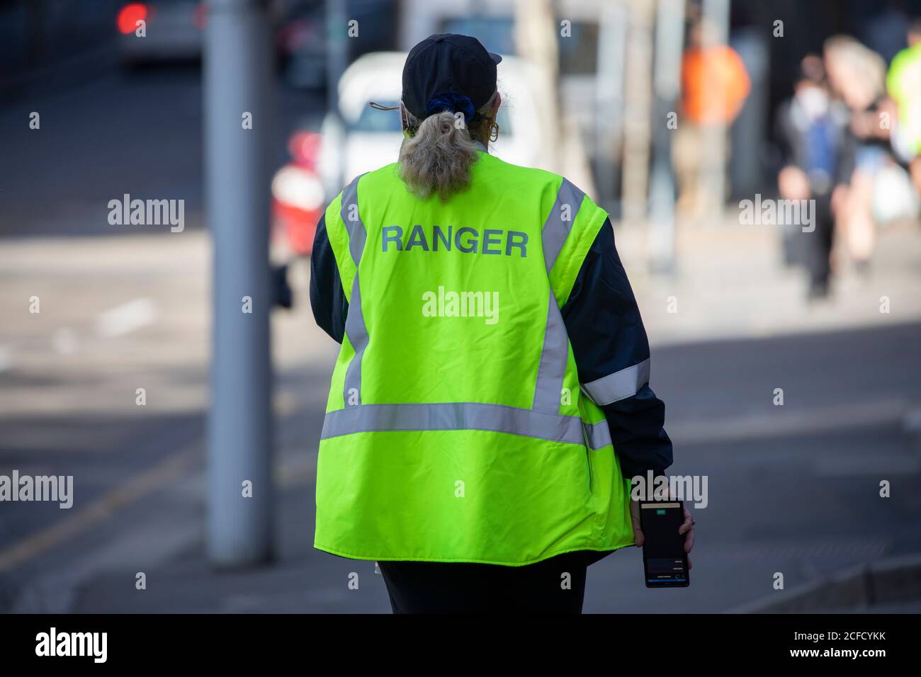 Sydney council ranger at work enforcing local government laws in Sydney city centre,NSW,Australia Stock Photo