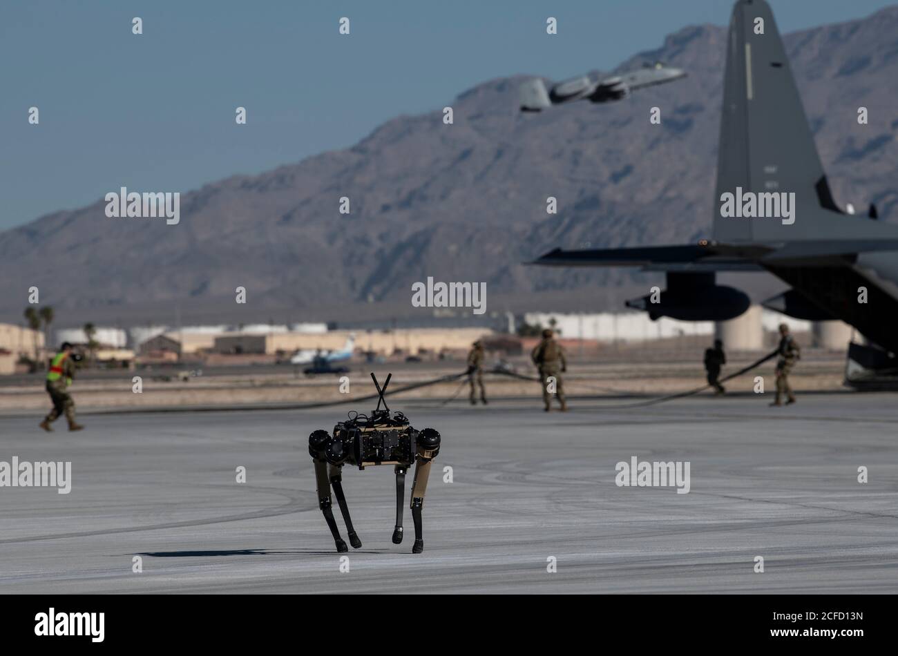 A Ghost Robotics Vision 60 prototype provides security at a simulated austere base during the Advanced Battle Management System exercise on Nellis Air Force Base, Nev., Sept. 3, 2020. The ABMS is an interconnected battle network - the digital architecture or foundation - which collects, processes and shares data relevant to warfighters in order to make better decisions faster in the kill chain. In order to achieve all-domain superiority, it requires that individual military activities not simply be de-conflicted, but rather integrated – activities in one domain must enhance the effectiveness o Stock Photo