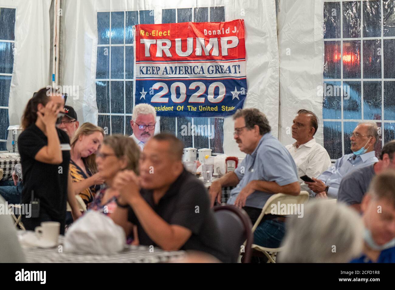 New York, United States. 03rd Sep, 2020. A banner for Trump/Pence US election ticket seen during a Steve Bannon Speaking Engagement on Zoom with Queens Village Republican Club in Triple Crown Diner, Middle Village, Queens. Credit: SOPA Images Limited/Alamy Live News Stock Photo