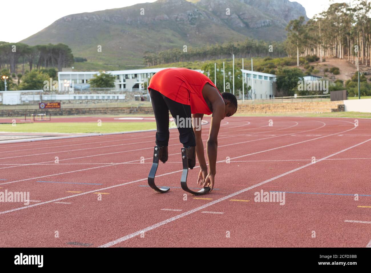 Male athlete with prosthetic leg performing stretching exercise Stock Photo Alamy