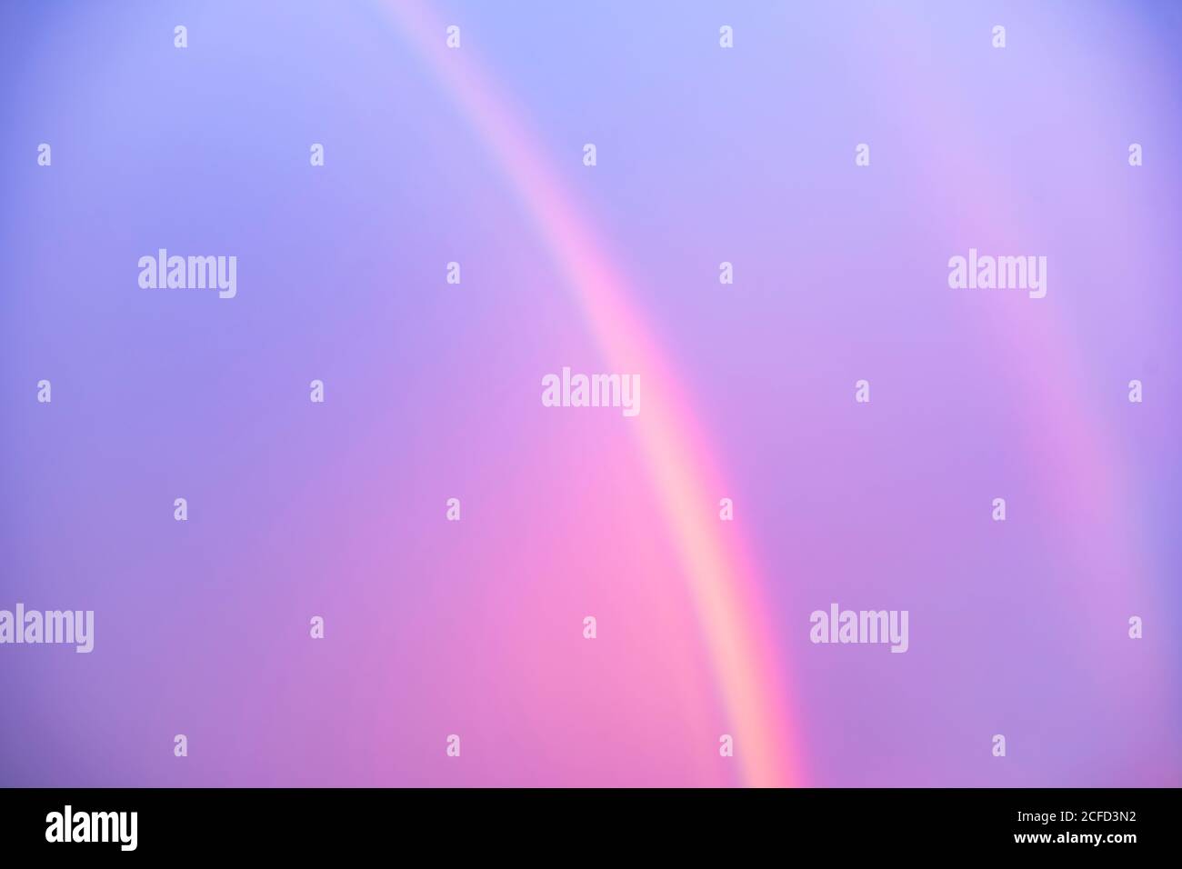 Rainbow with the sun low. Stock Photo