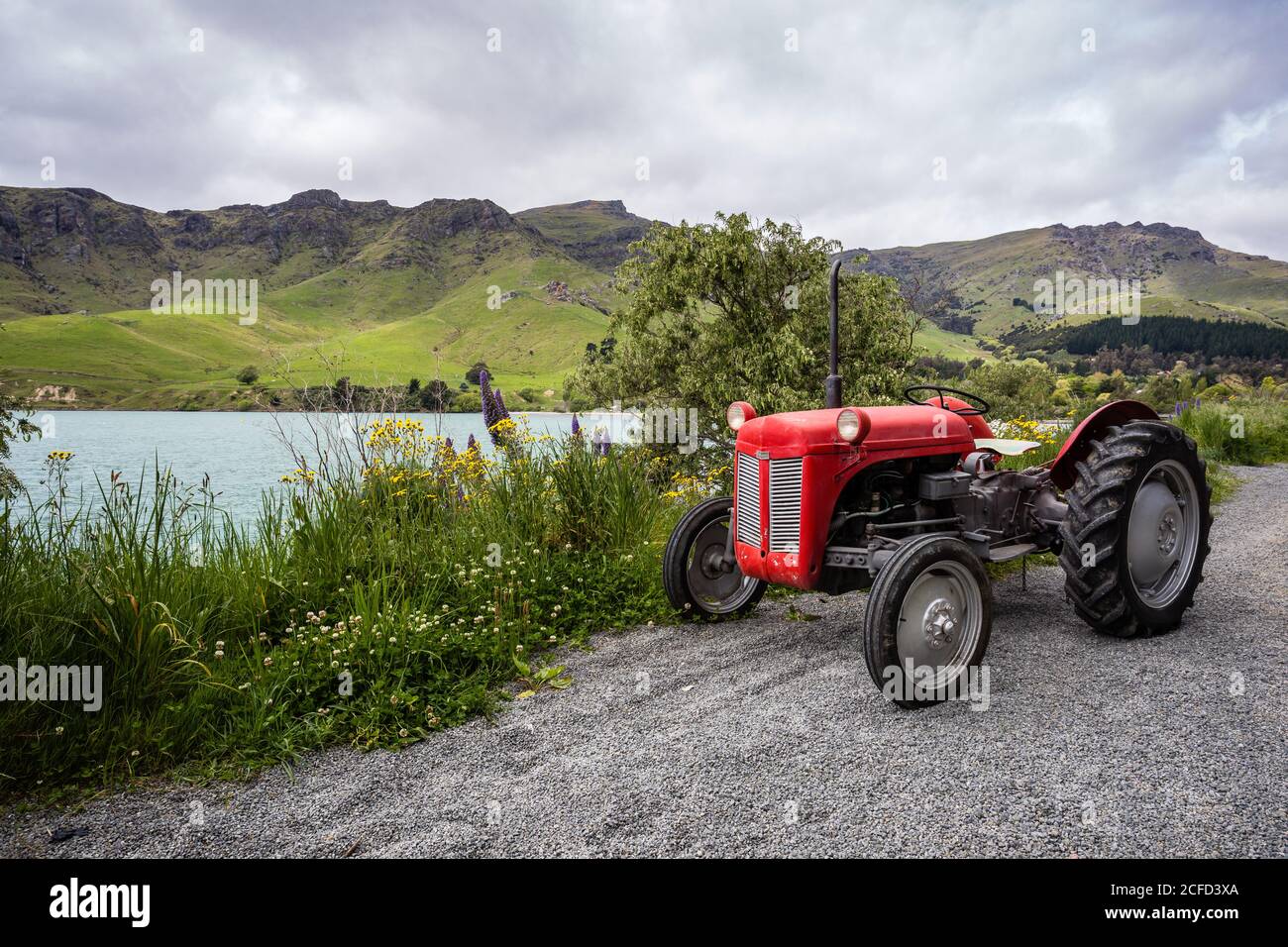 red vintage tractor, camper trip New Zealand, Diamond Habour Stock Photo