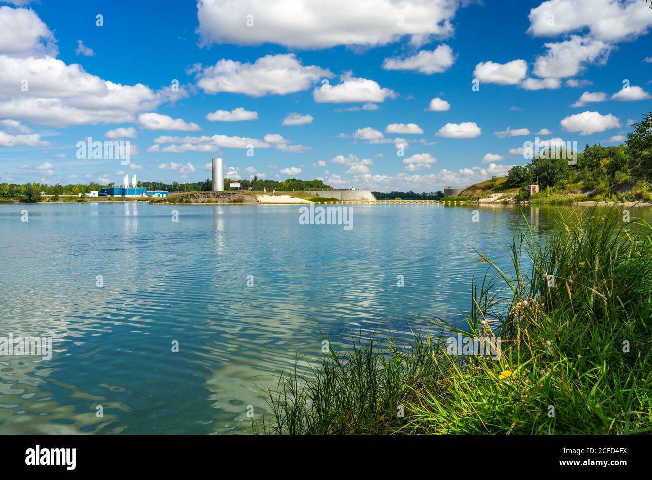 The calm waters of Lake Minnewasta and its water treatment facility near Morden, Manitoba, Canada. Stock Photo