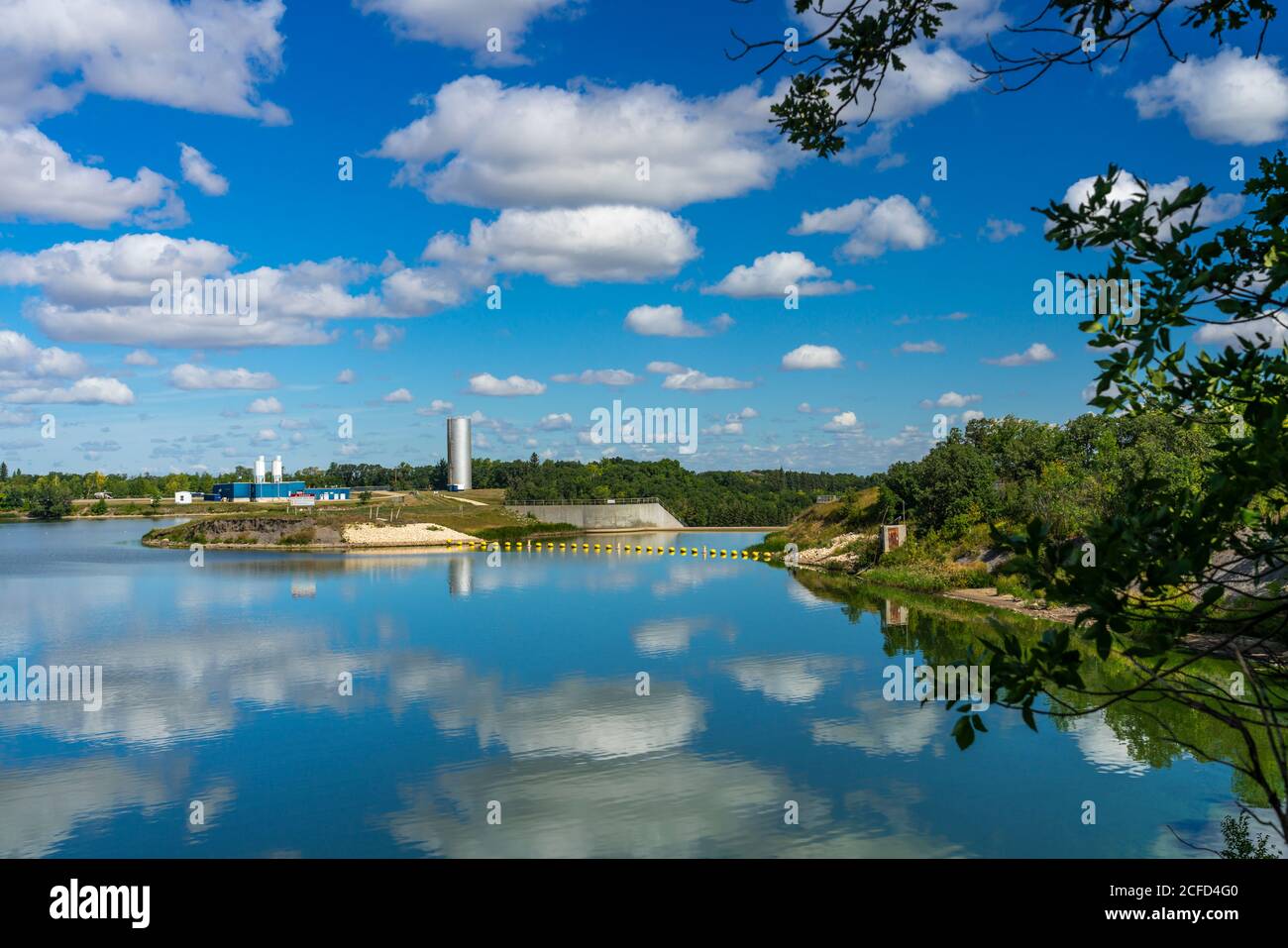 The calm waters of Lake Minnewasta and its water treatment facility near Morden, Manitoba, Canada. Stock Photo