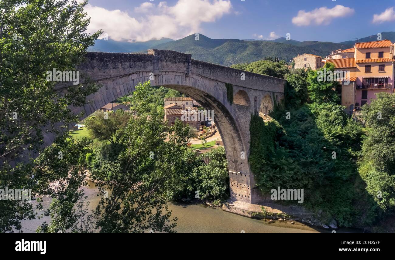 Le Pont du Diable over the Tech river at Céret. The single-arch stone bridge was built in the XIV century and its only arch is 45 meters wide. Stock Photo
