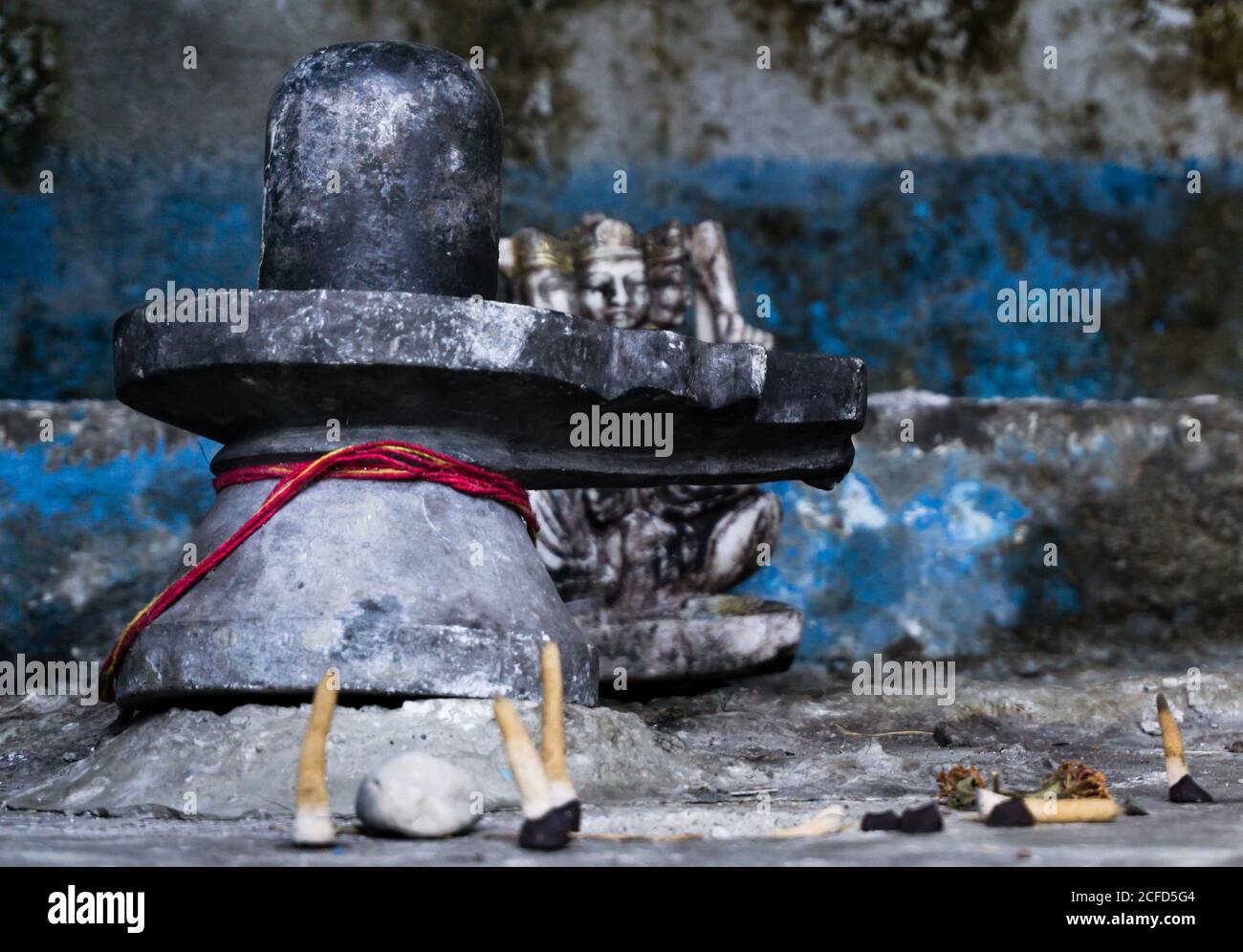 A close up shot of black shiva linga, also called Lingam. Stock Photo