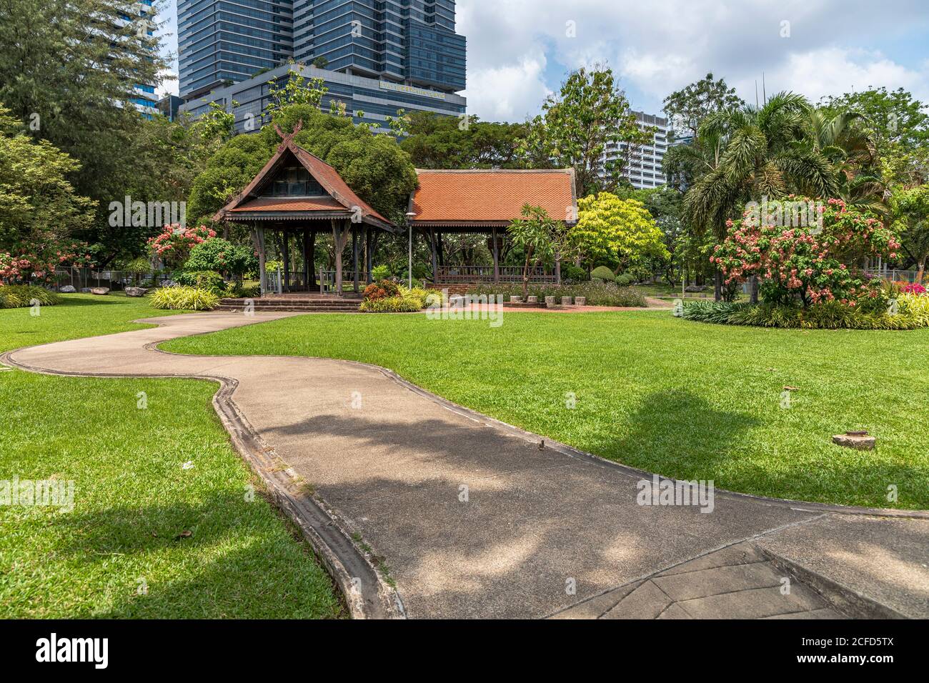 Well-kept path and pavilion in Lumphini Park in Silom, Bangkok, Thailand Stock Photo
