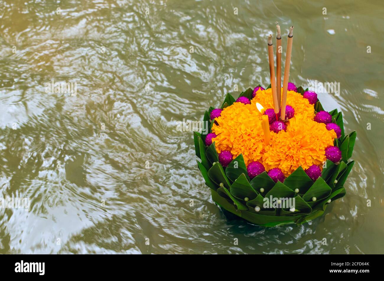 Banana leaf Krathong floating on river for Thailand full moon or Loy ...