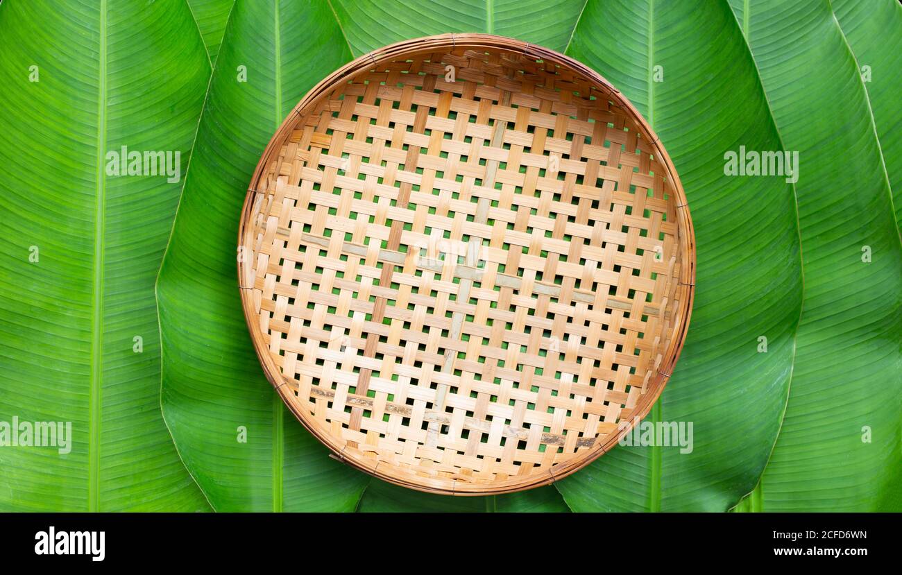 Empty Wooden Bamboo Threshing Basket On Banana Leaves Background Top View Stock Photo Alamy Empty Wooden Bamboo Threshing Basket On Banana Leaves Background Top View Stock Photo Alamy