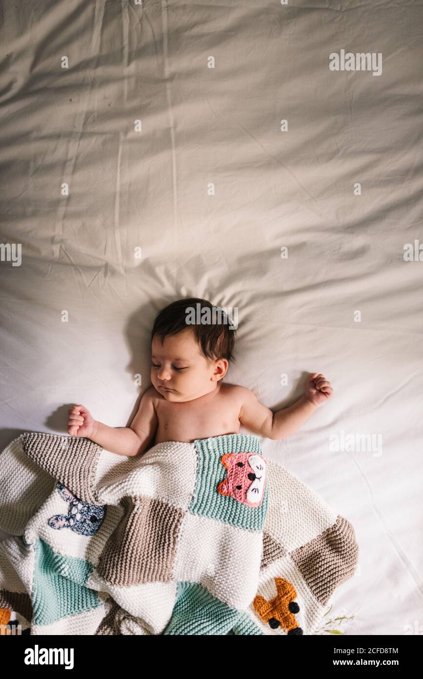 Cute baby sleeping on bed Stock Photo Alamy