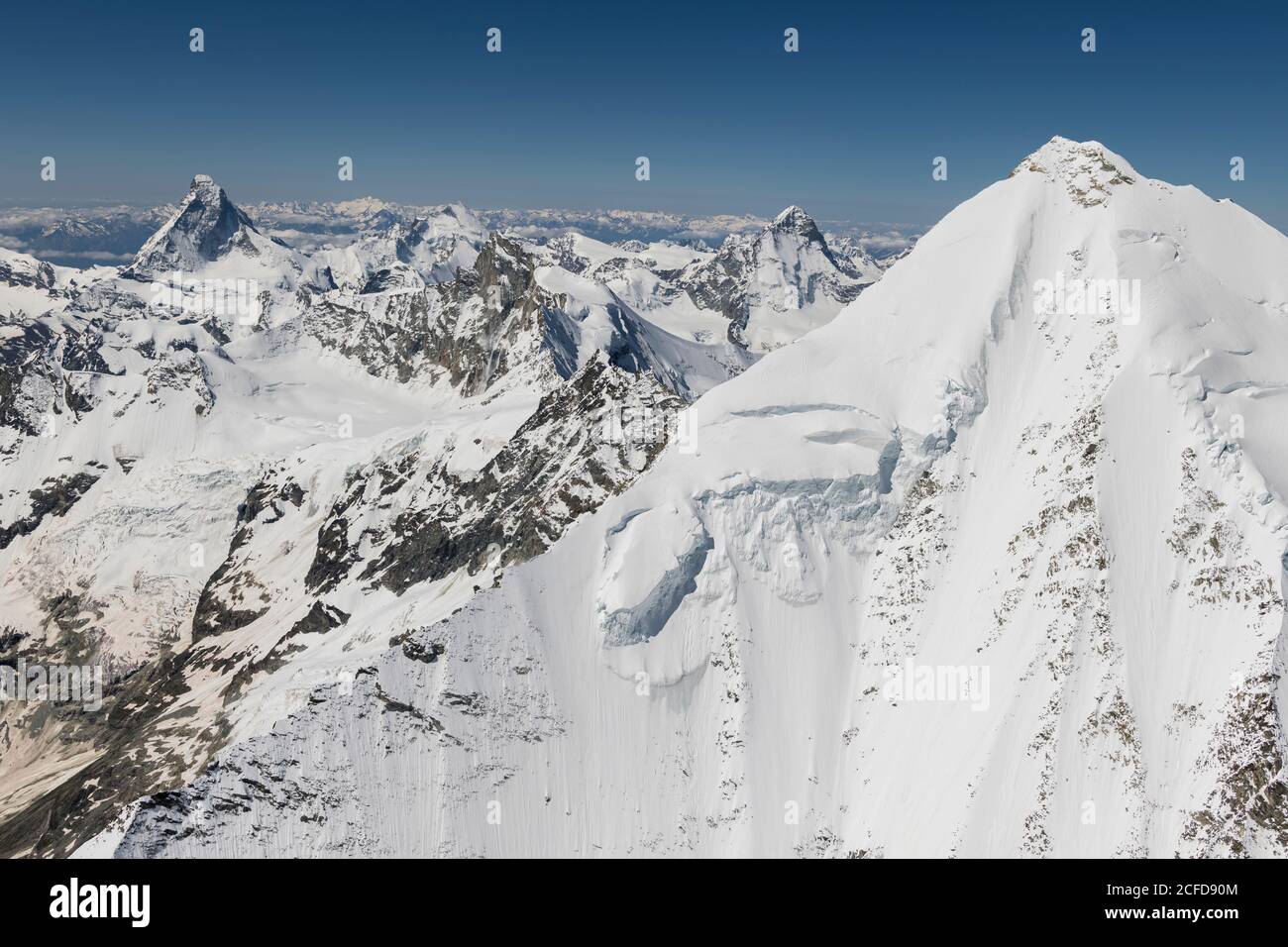 Switzerland, Valais canton, Valais Alps, Weisshorn Ostgrat in the foreground, Matterhorn, Dent d'Herens, Obergabelhorn, Zinalrothorn and Dent Blanche Stock Photo