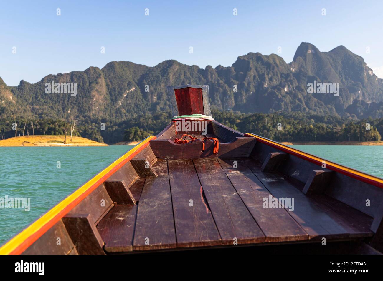 Top of a longtail boat on the Ratchaprapha lake with high karst rocks in the Khao Sok National Park, Khao Sok. Thailand Stock Photo